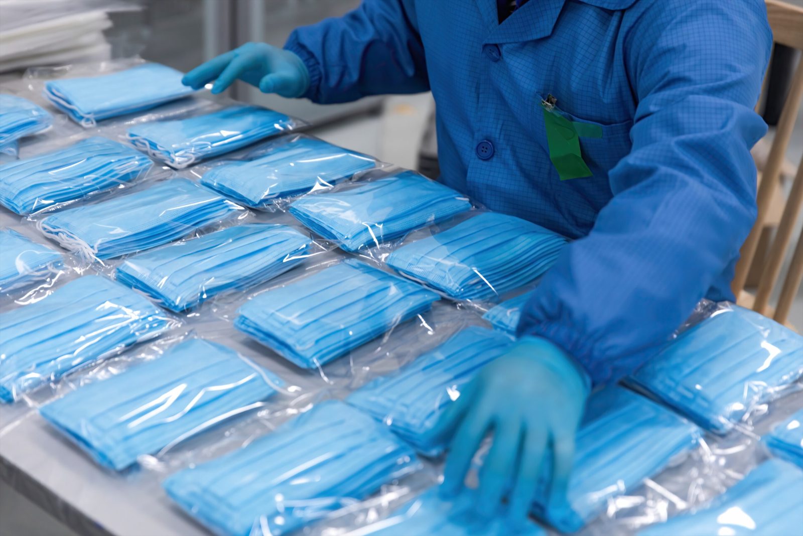 PPE equipment including masks, gloves, and sanitizer on a table for Covid safety