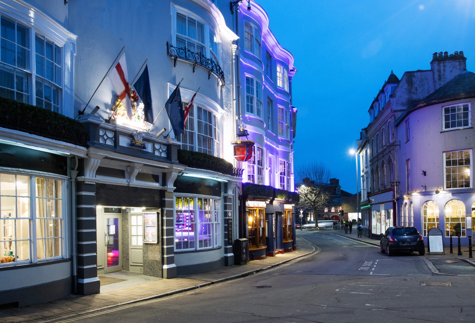 Busy high street with pubs, bars, and restaurants, illustrating a Cumulative Impact Assessment area.