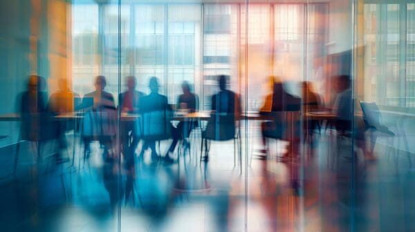 Abstract silhouette of a corporate board meeting around a conference table